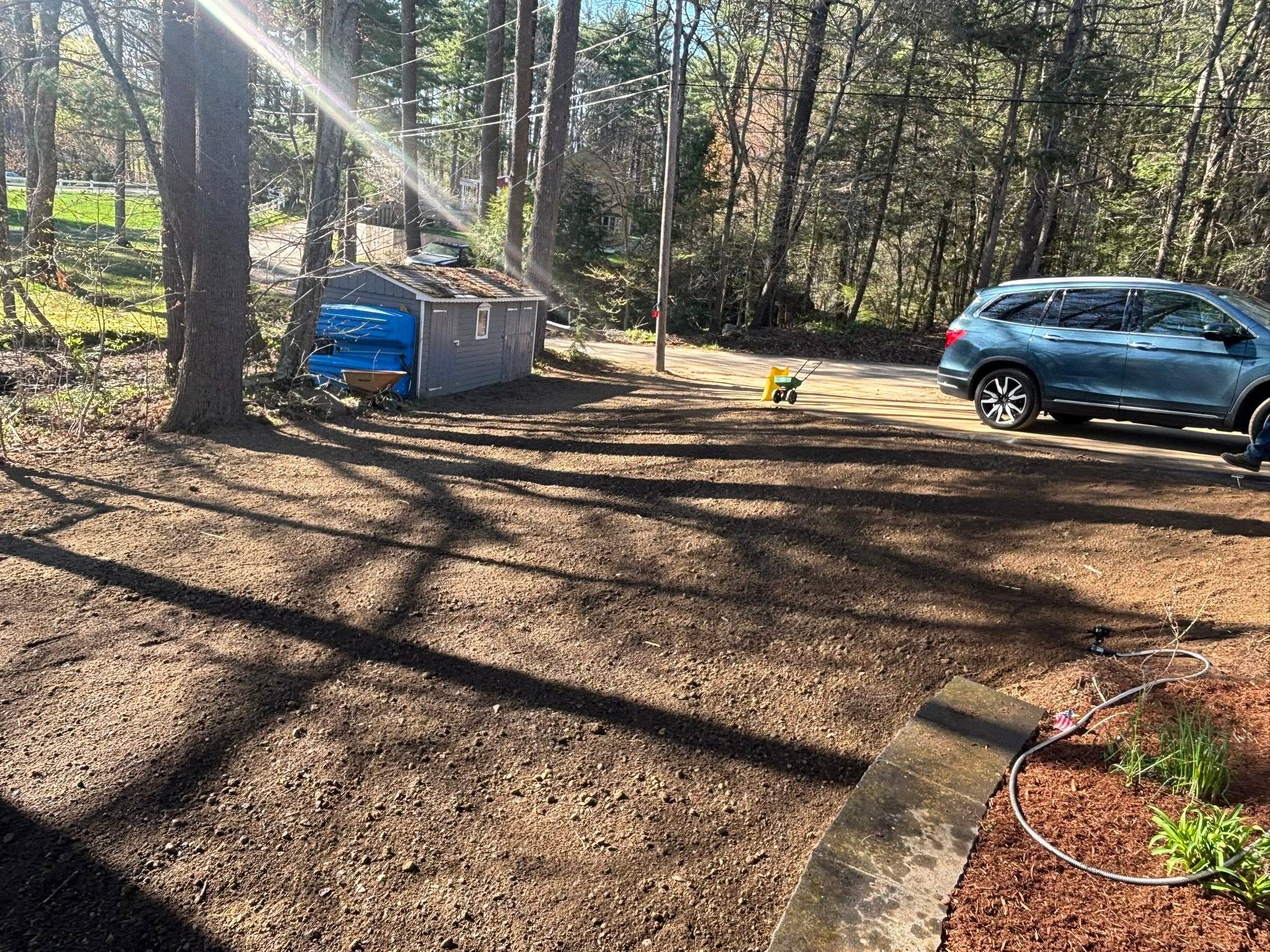 Final view — yard ready for seeding after full restoration
